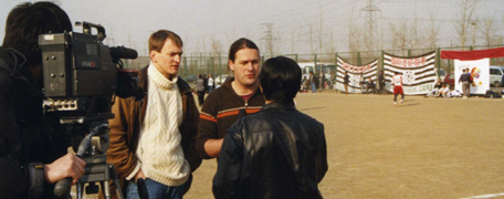 the iffc praesident robert gonella and laowai organisator guleyan interviewed at the football match